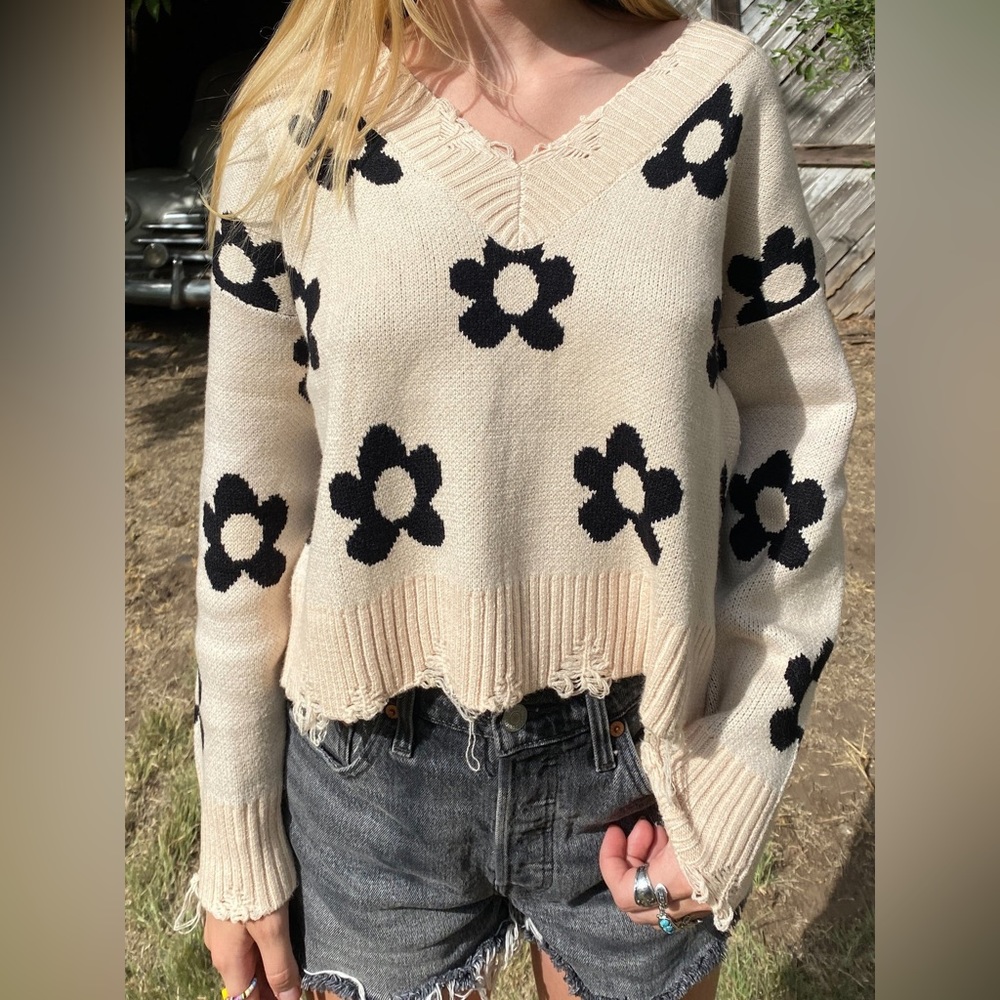Distressed flower sweater
